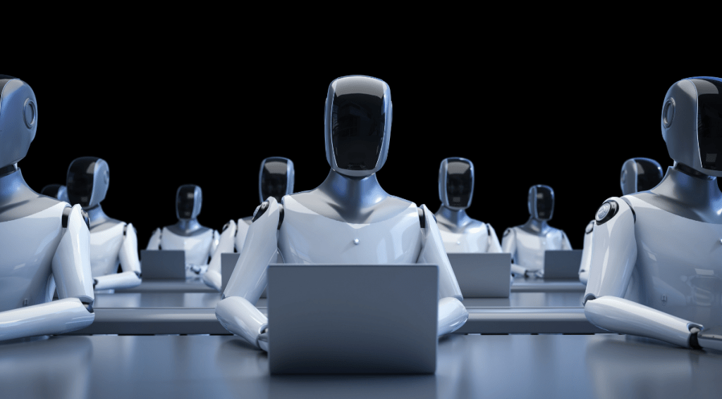 Robot umanoidi che lavorano al computer, simbolo dell’automazione e dell’impatto dell’AI sul mercato del lavoro.